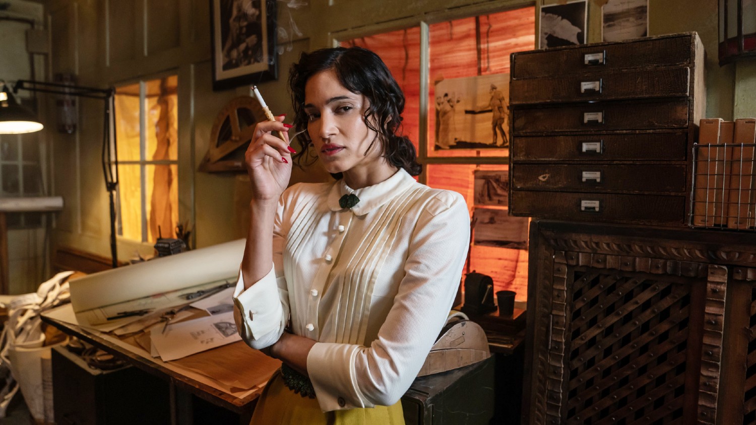 Sofia Boutella holding a cigarette in SAS Rogue Heroes
