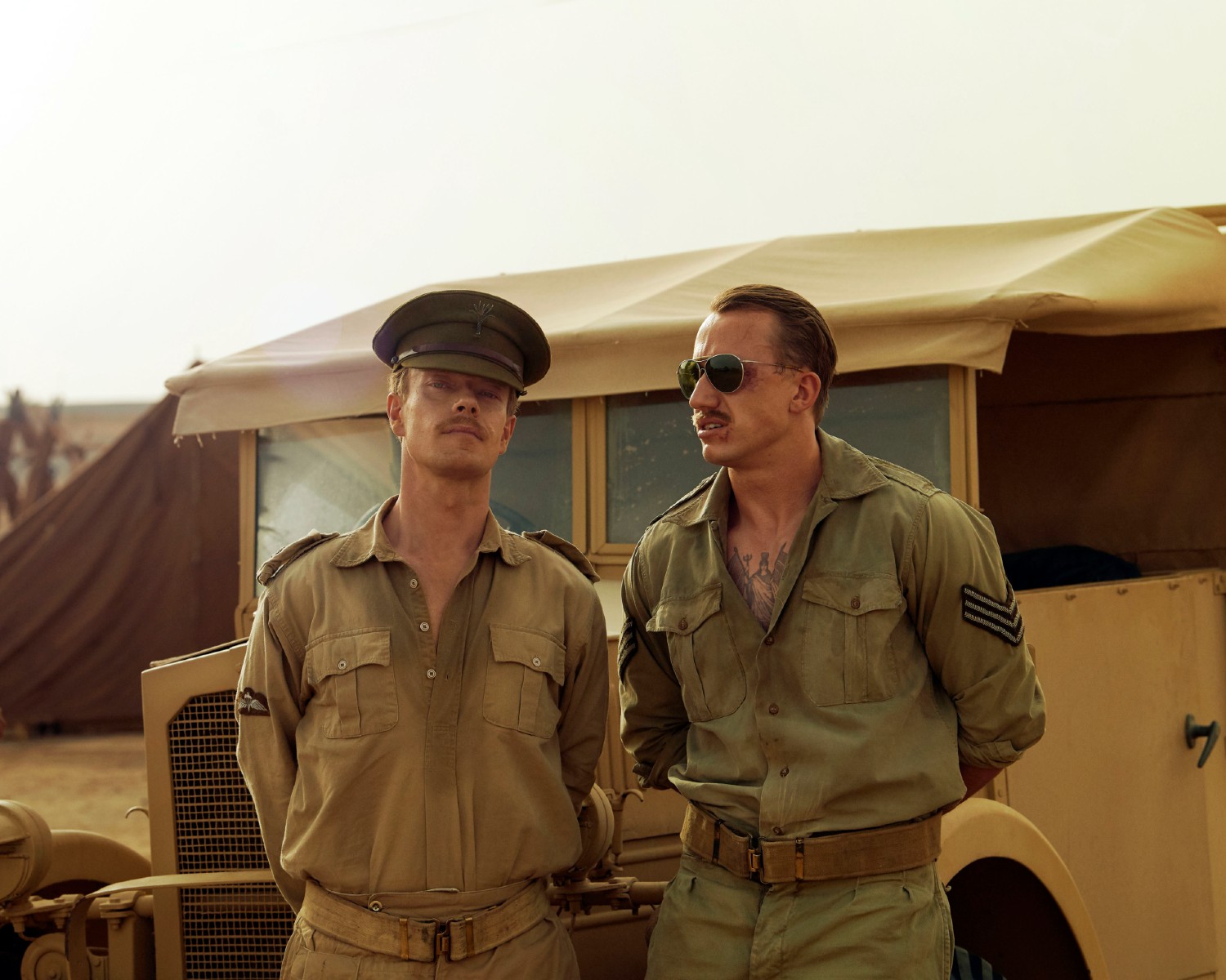 Theo Barklem-Biggs and Alfie Allen in front of a truck in SAS Rogue Heroes