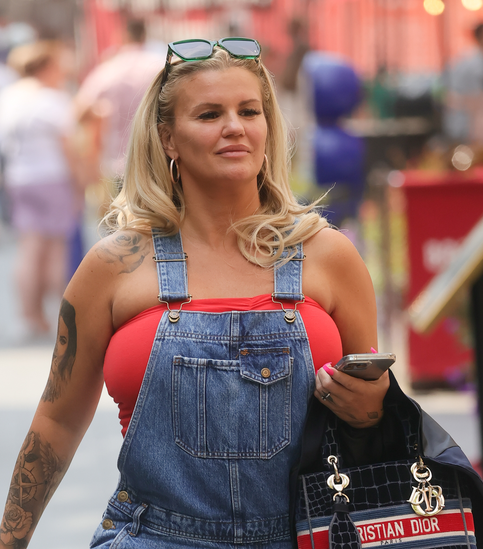 Kerry Katona wearing denim dungarees. 