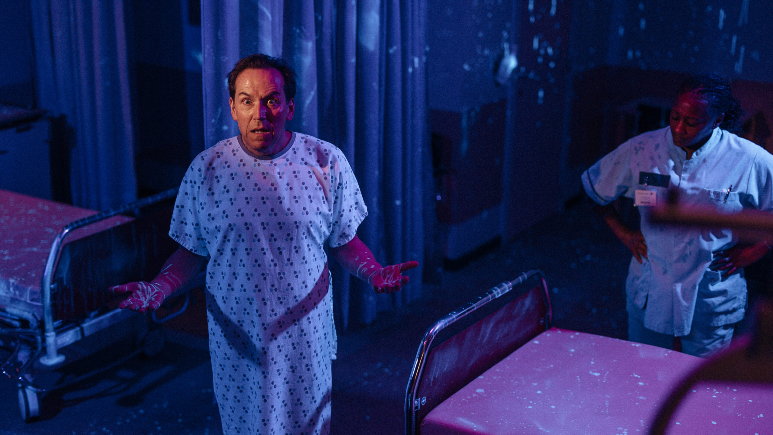 Ben Miller as Professor Jasper Tempest, he looks angry in a hospital gown