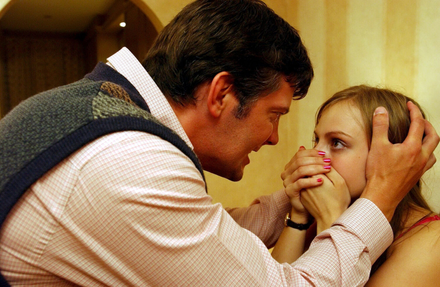 Gary Adams in Coronation Street angrily grabs Sarah Platt by the head