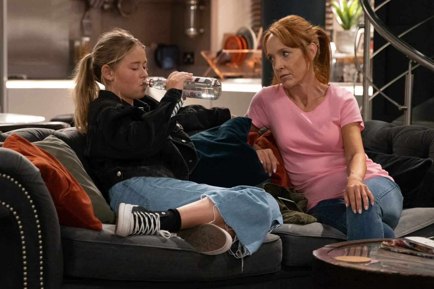 Sandra watches as Liv drinks