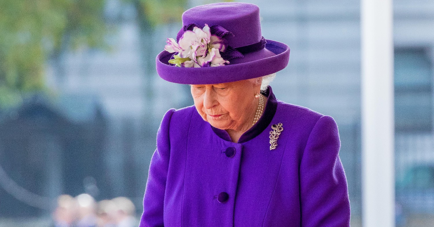 The Queen in purple looking down