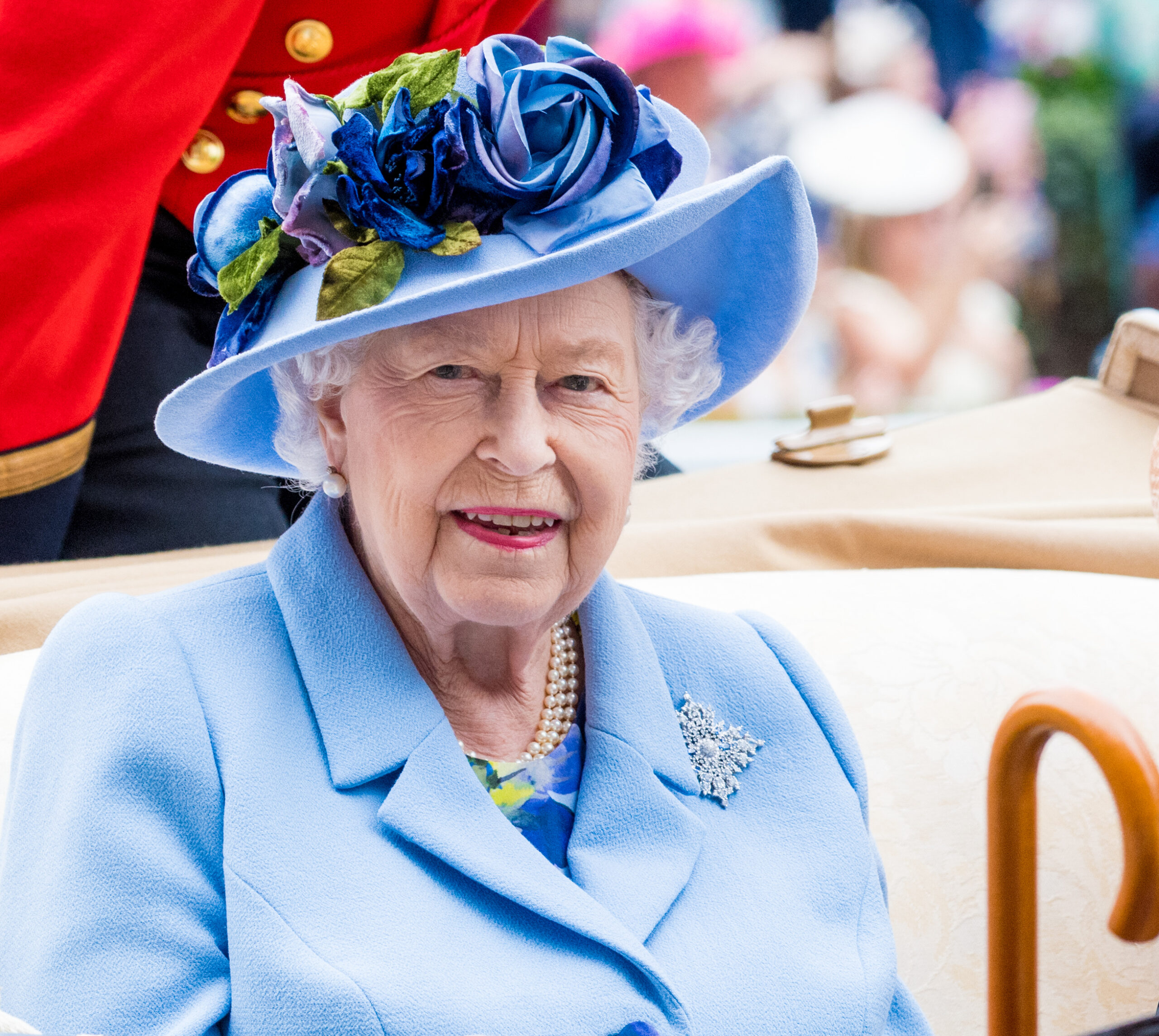 The late Queen Elizabeth II wearing blue.