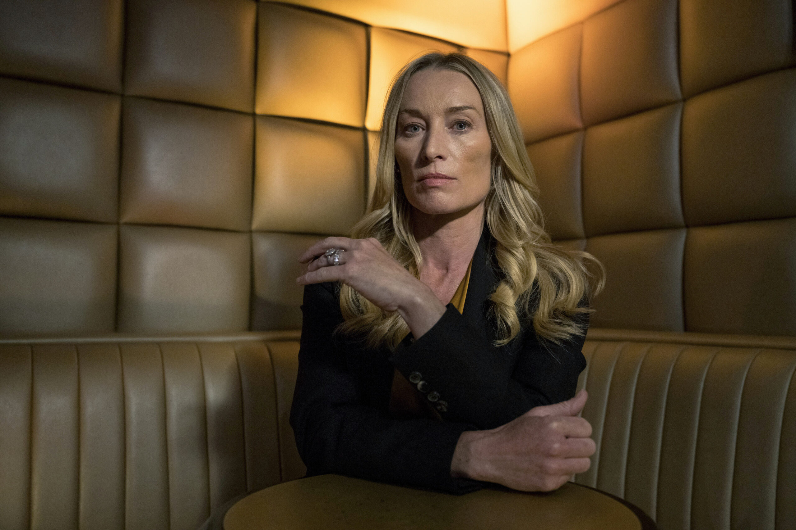 ,Olivia Foyle (VICTORIA SMURFIT) in Bloodlands S2 EPISODE 1, she sits in a restaurant in a black top looking angry