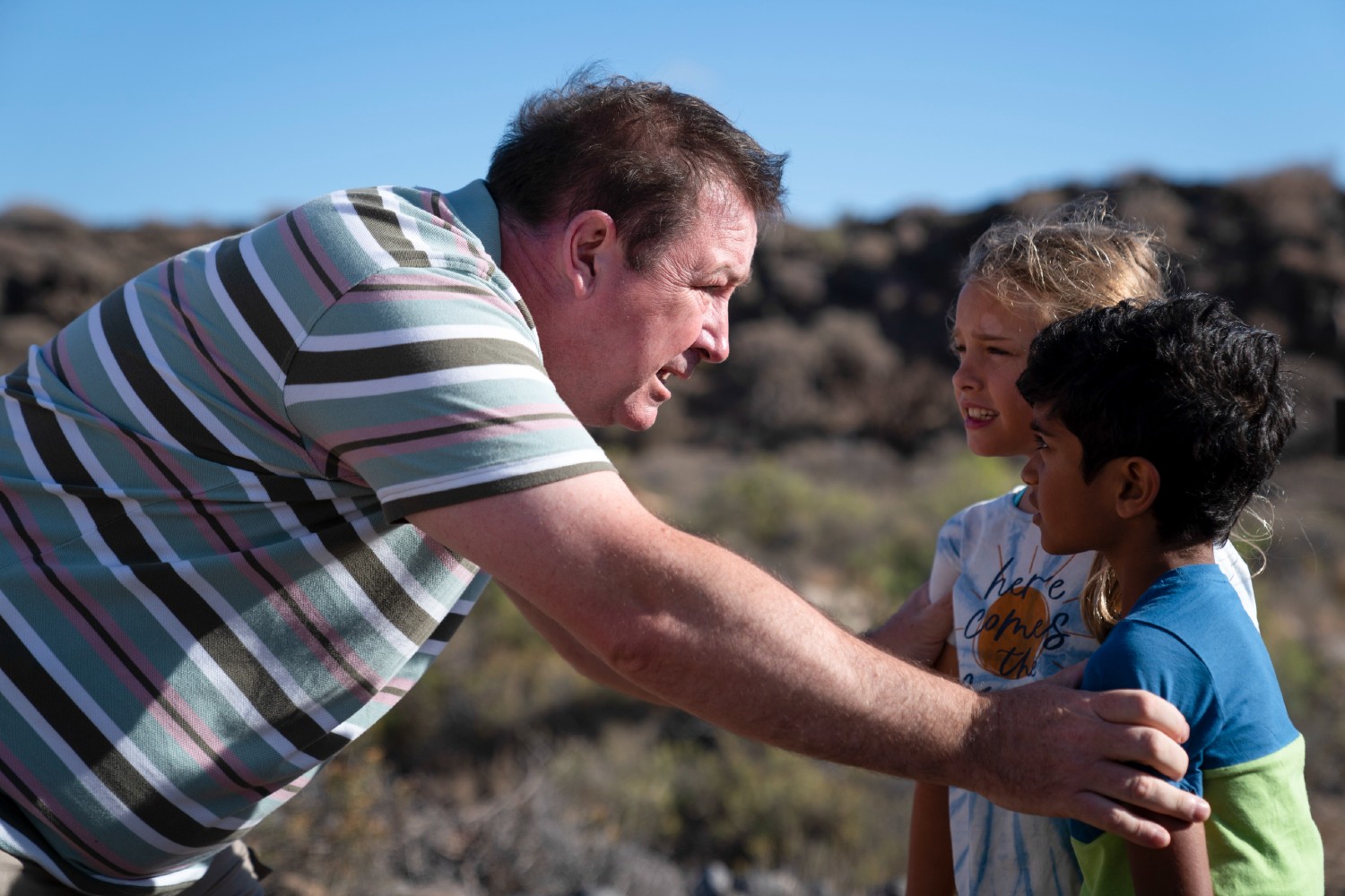 Ben with two children in Crossfire