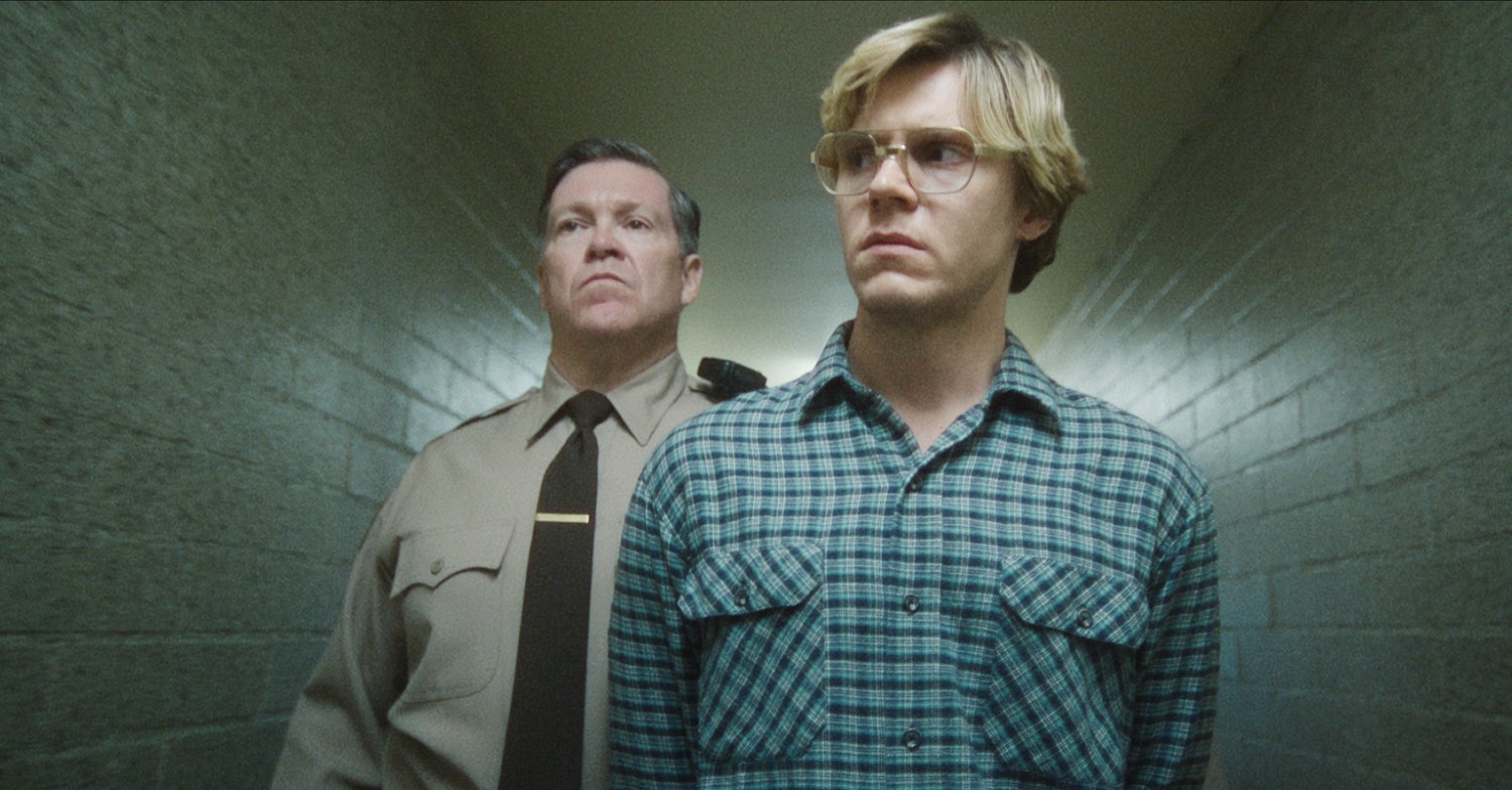 Evan Peters being escorted by the police in Monster: The Jeffery Dahmer Story