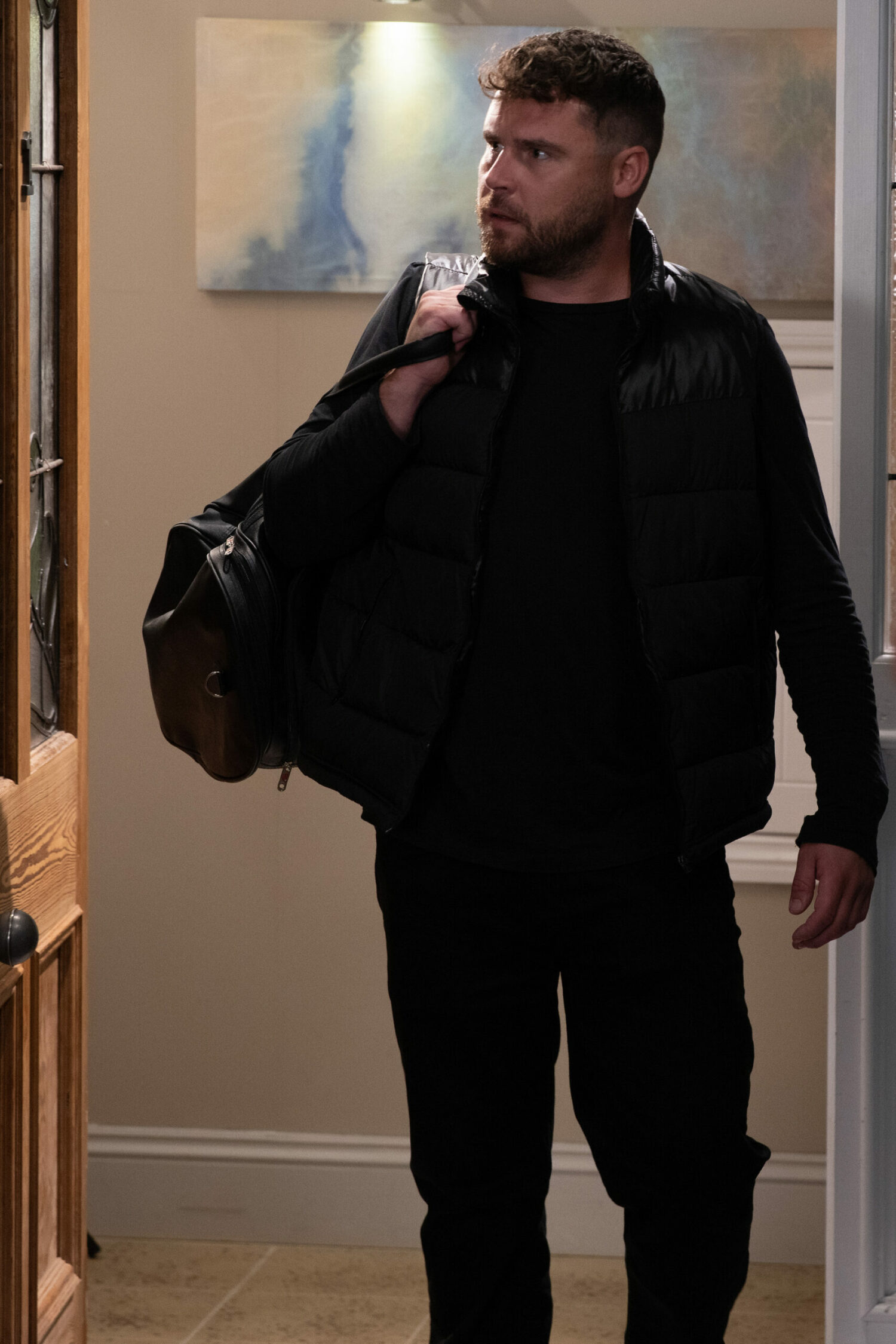 Aaron returns holding a bag Emmerdale Danny Miller