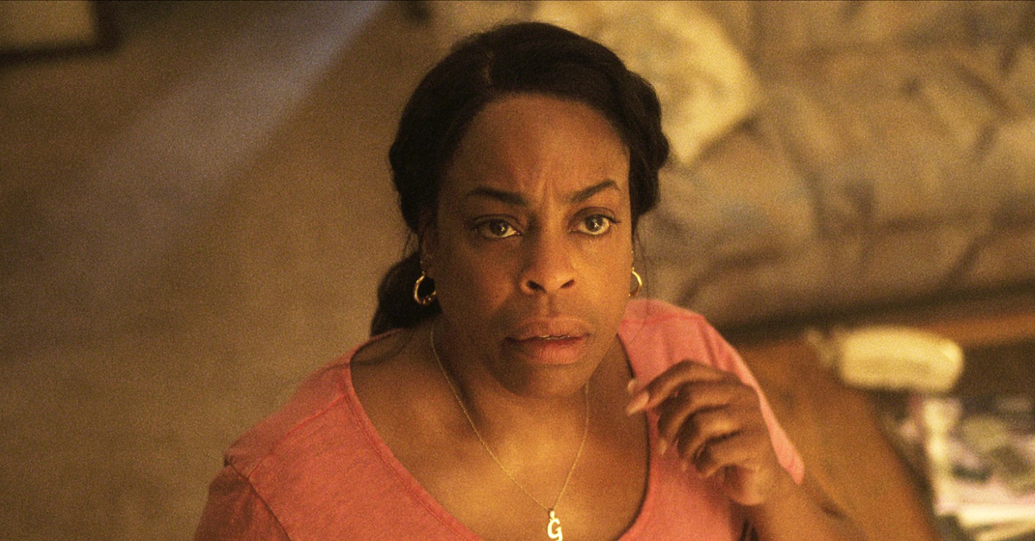 Niecy Nash looking up in Monster: The Jeffrey Dahmer Story