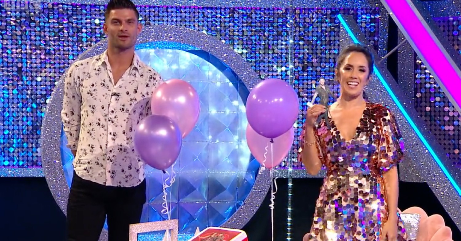 Aljaz and Janette standing and facing camera on It Takes Two