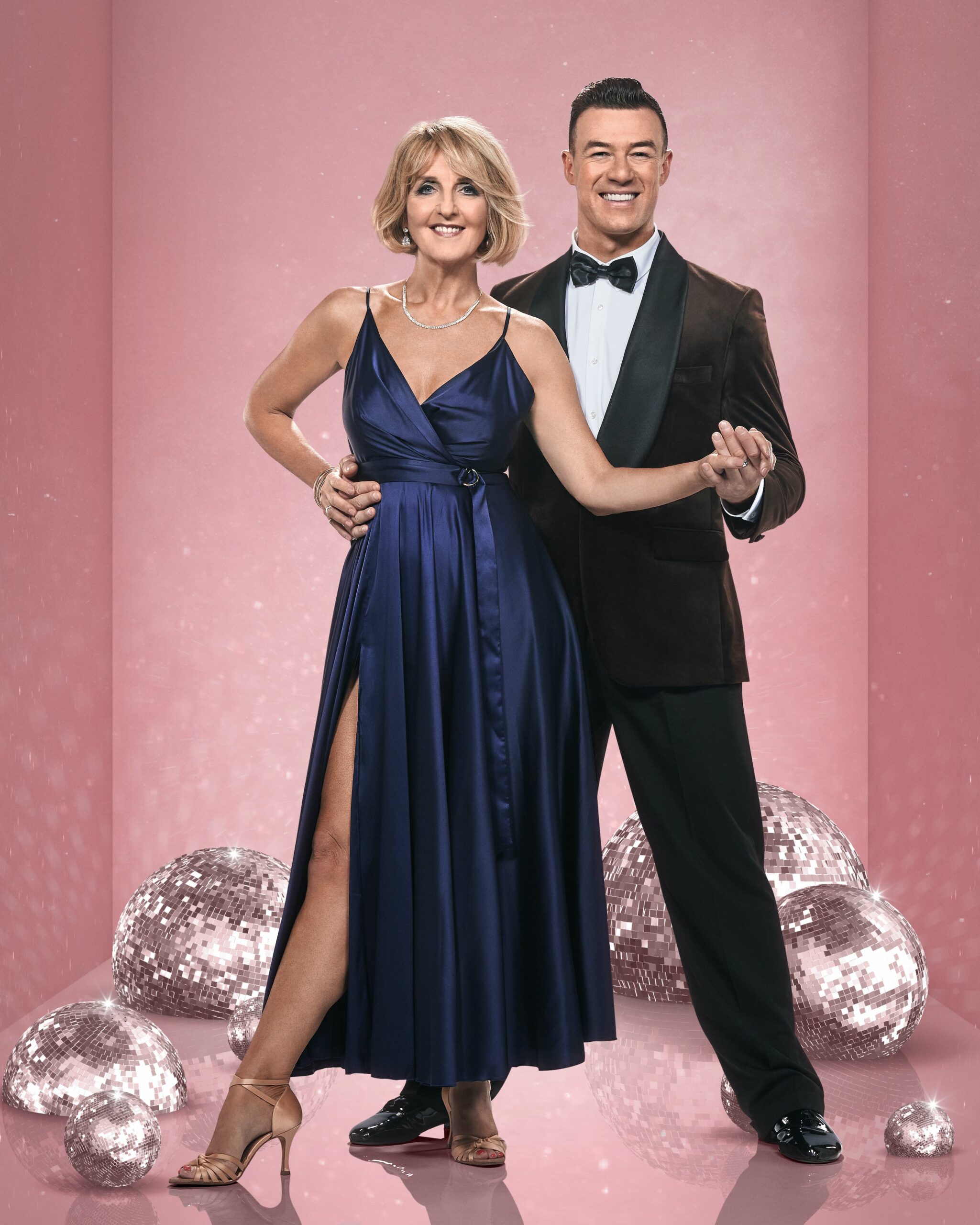 Kaye Adams smiling  with Kai Widdrington in Strictly promo pic