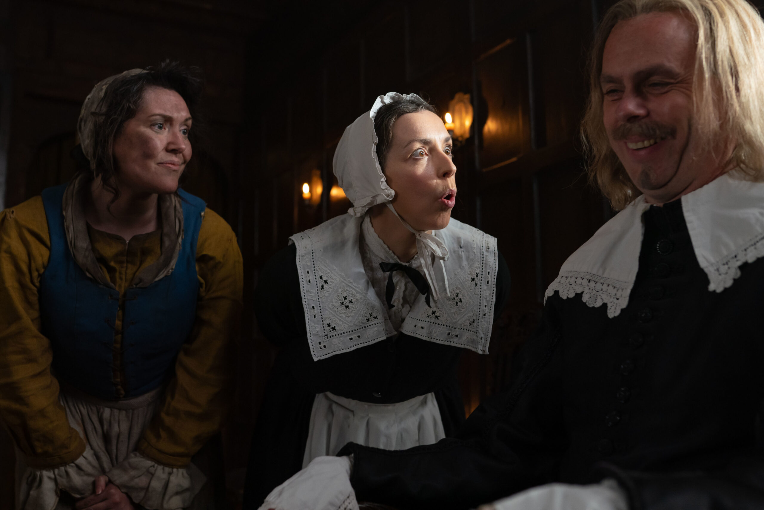 (KATY WIX), Annie (BRIDGET CHRISTIE), Issac Puritan Man (BRUCE MACKINNON) Annie shouts at the puritan man while Mary smiles next to her