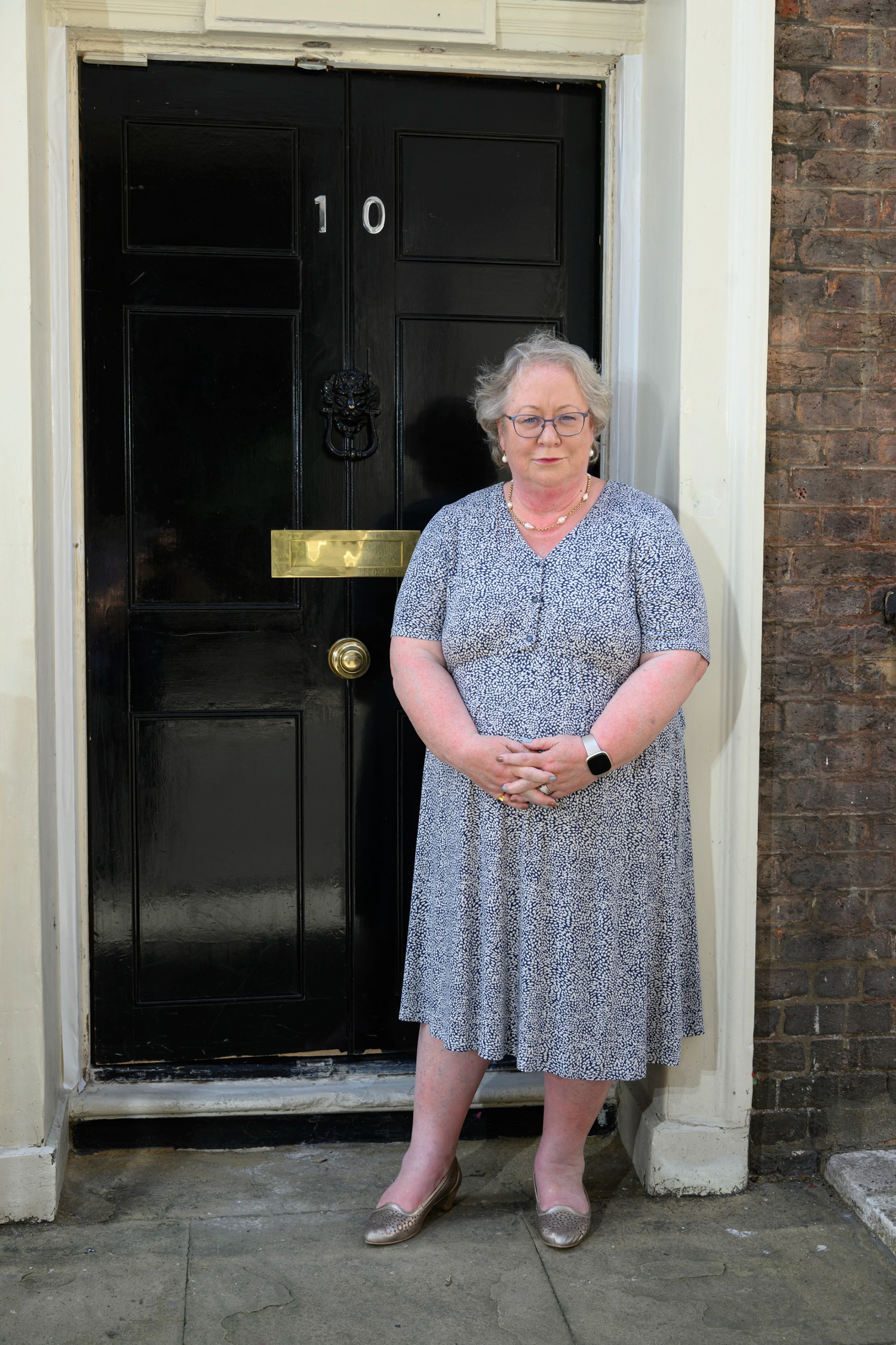 Jackie standing outside of 10 Downing Street
