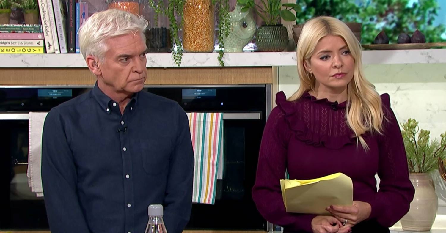 Phil and Holly look concerned