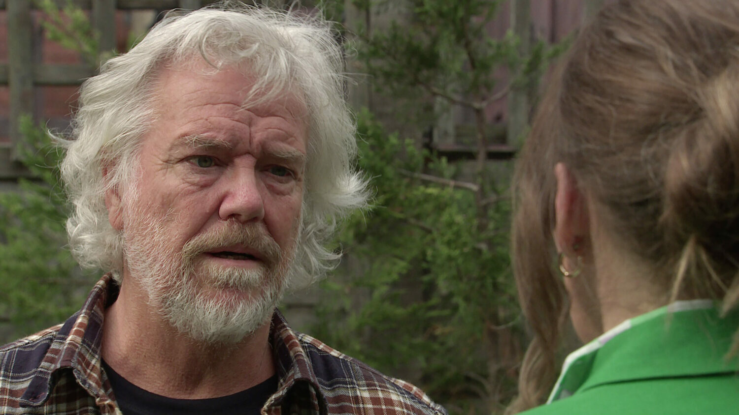 Coronation Street Stu looking upset outside speaking to Bridget