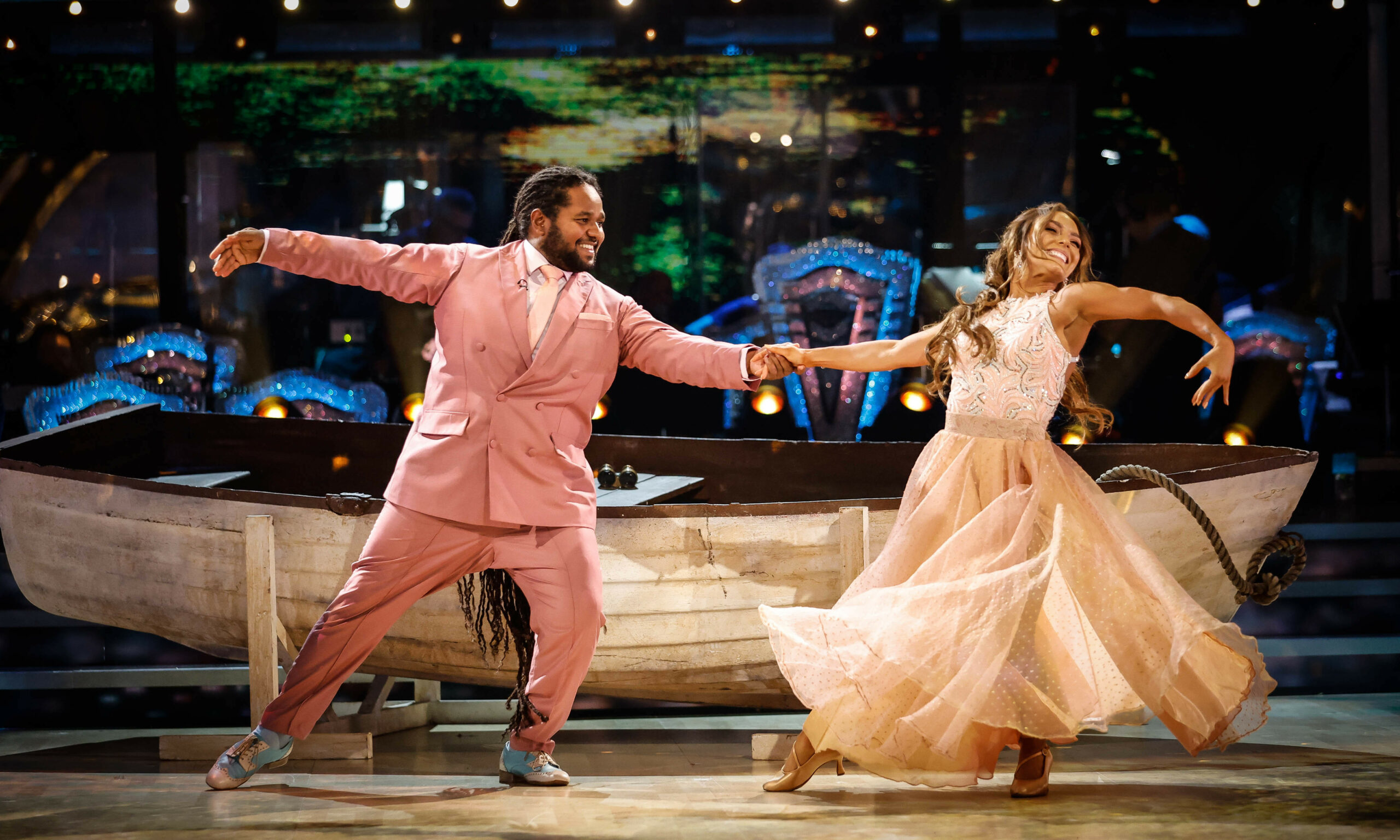 Hamza Yassin performing in pink suit during Strictly first live shows 