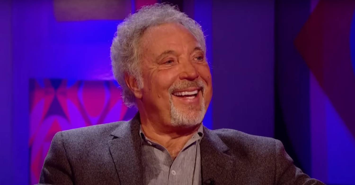 Tom Jones smiles widely