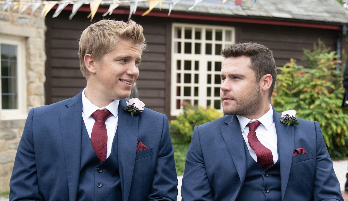 Emmerdale 50th anniversary: Robron on their wedding day in Emmerdale dressed in navy suits