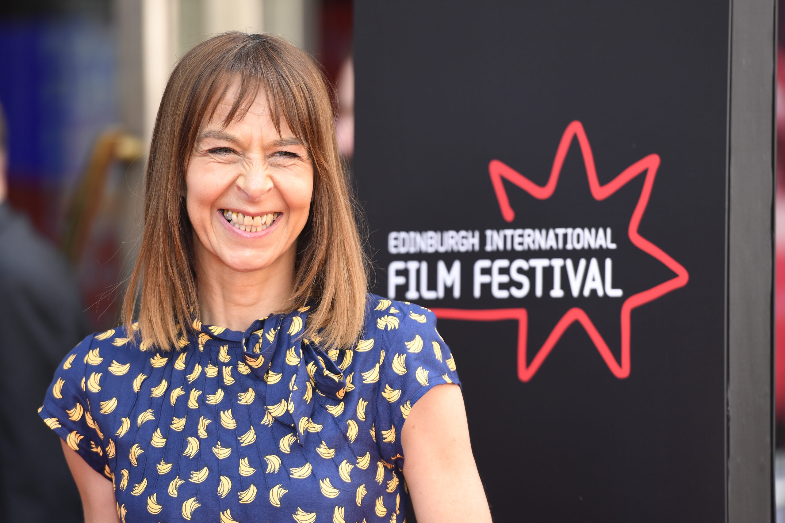 Kate Dickie smiling on the red carpet of the Edinburgh International Film Festival