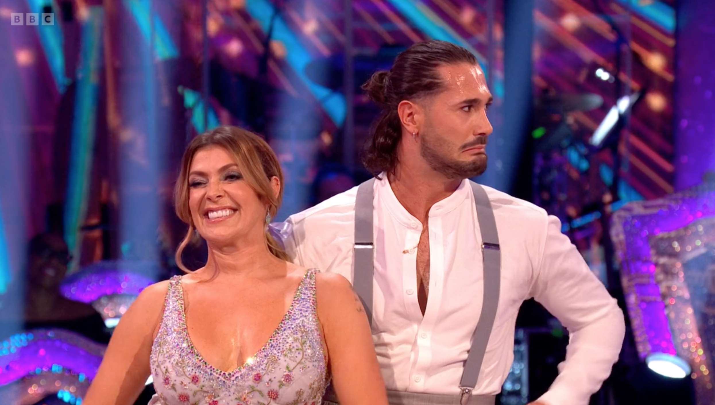 Kym Marsh smiles and Graziano looks awkward