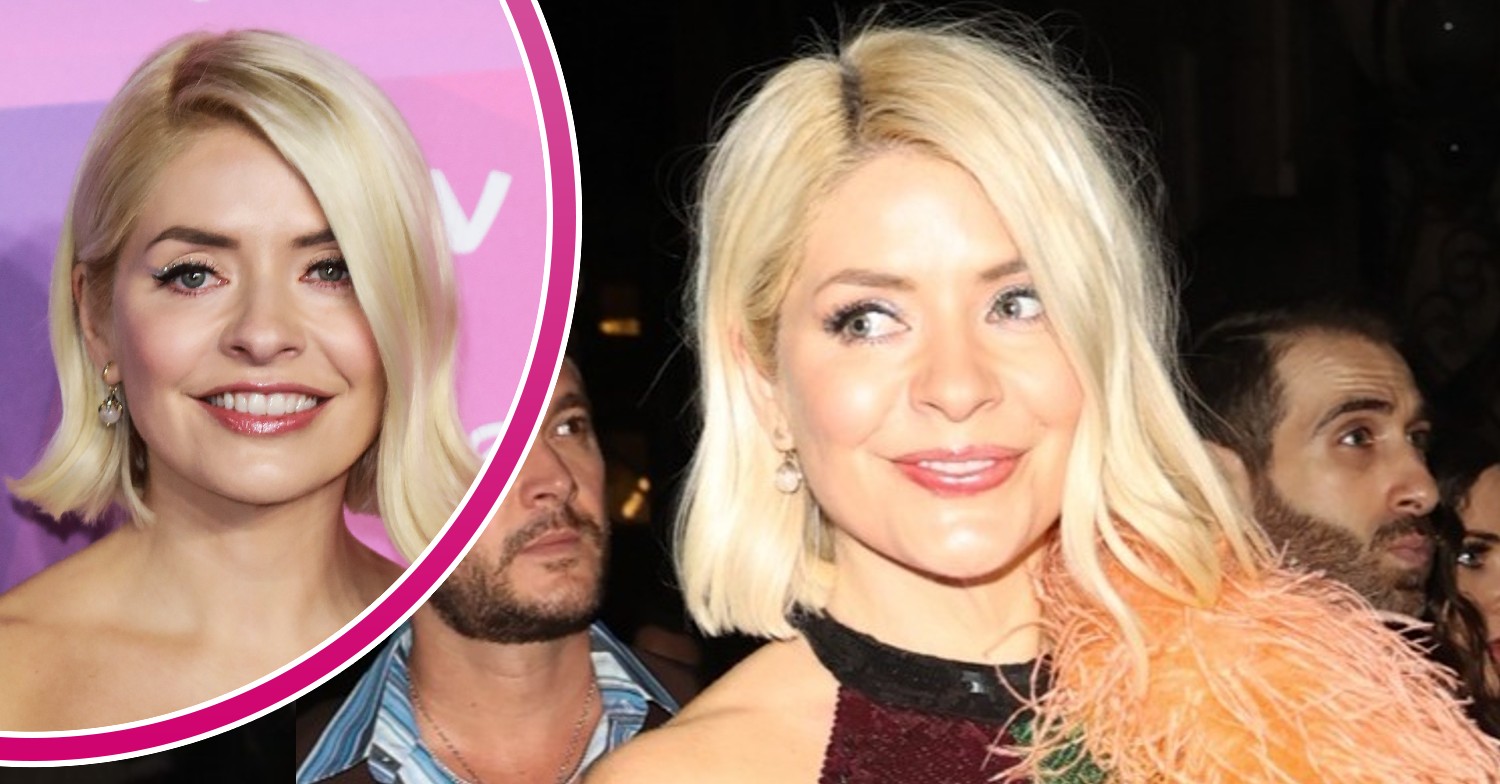 Holly Willoughby smiling on a night out