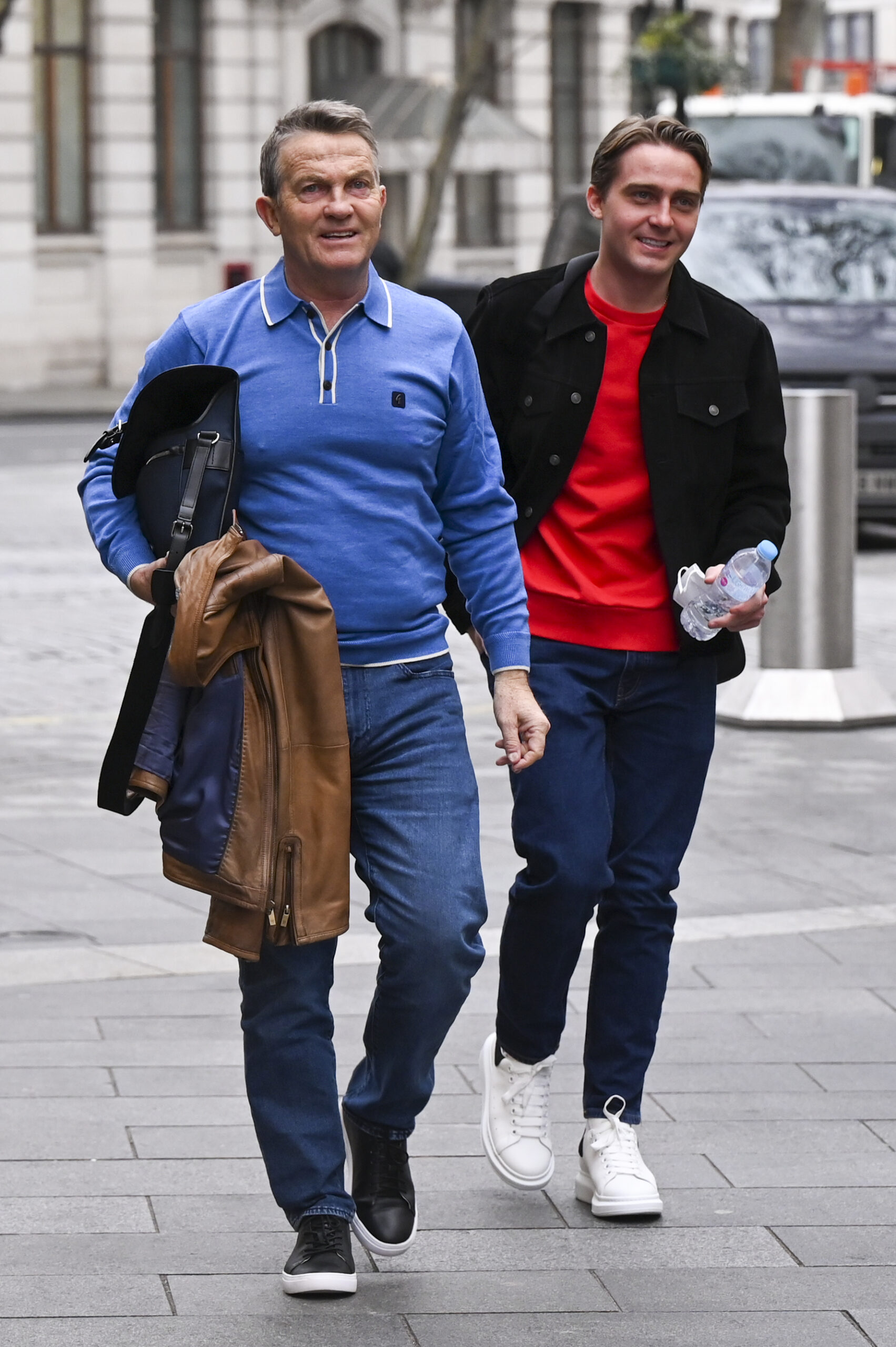 Bradley Walsh walking with his son Barney looking happy