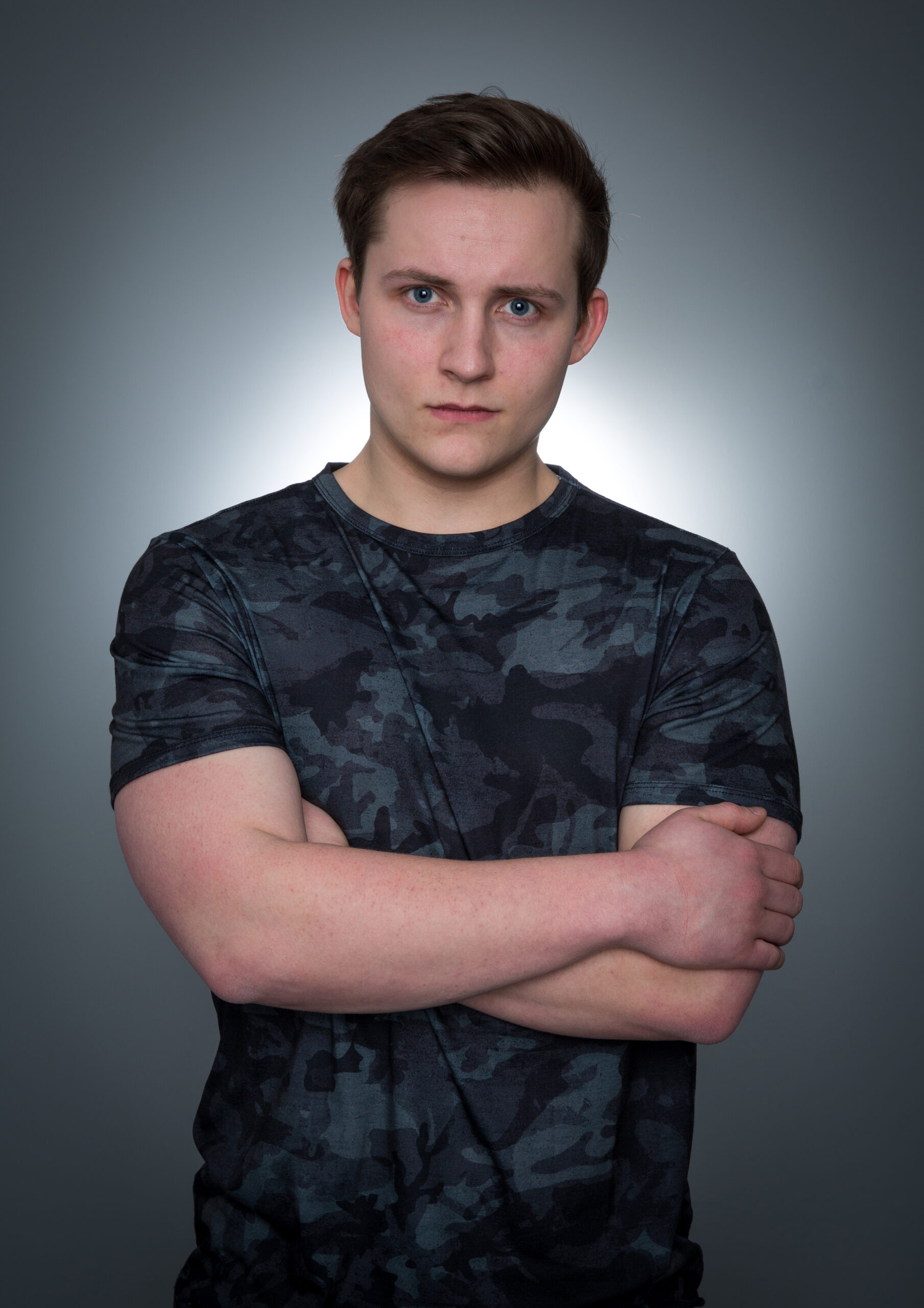 Emmerdale 50th anniversary: Lachlan White stands with his arms folded