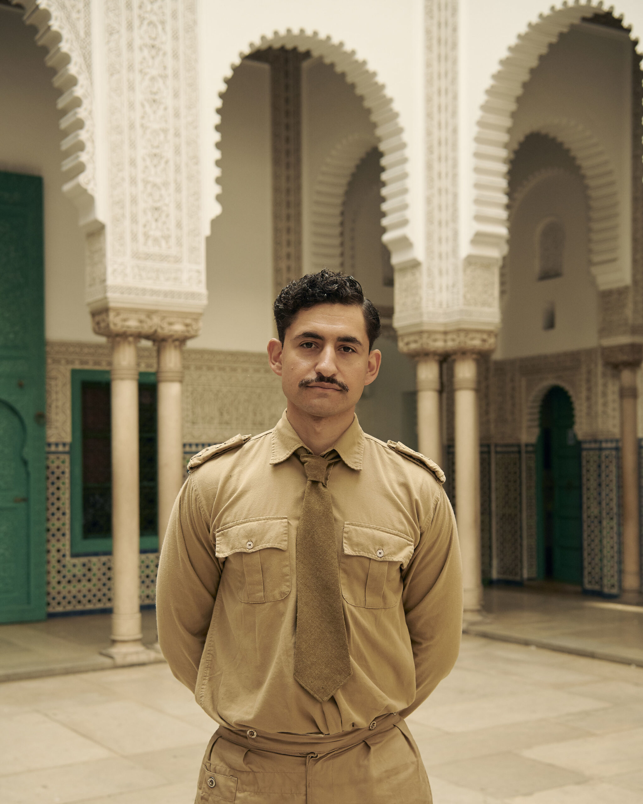 Amir El-Masry posing in the hospital in SAS Rogue Heroes