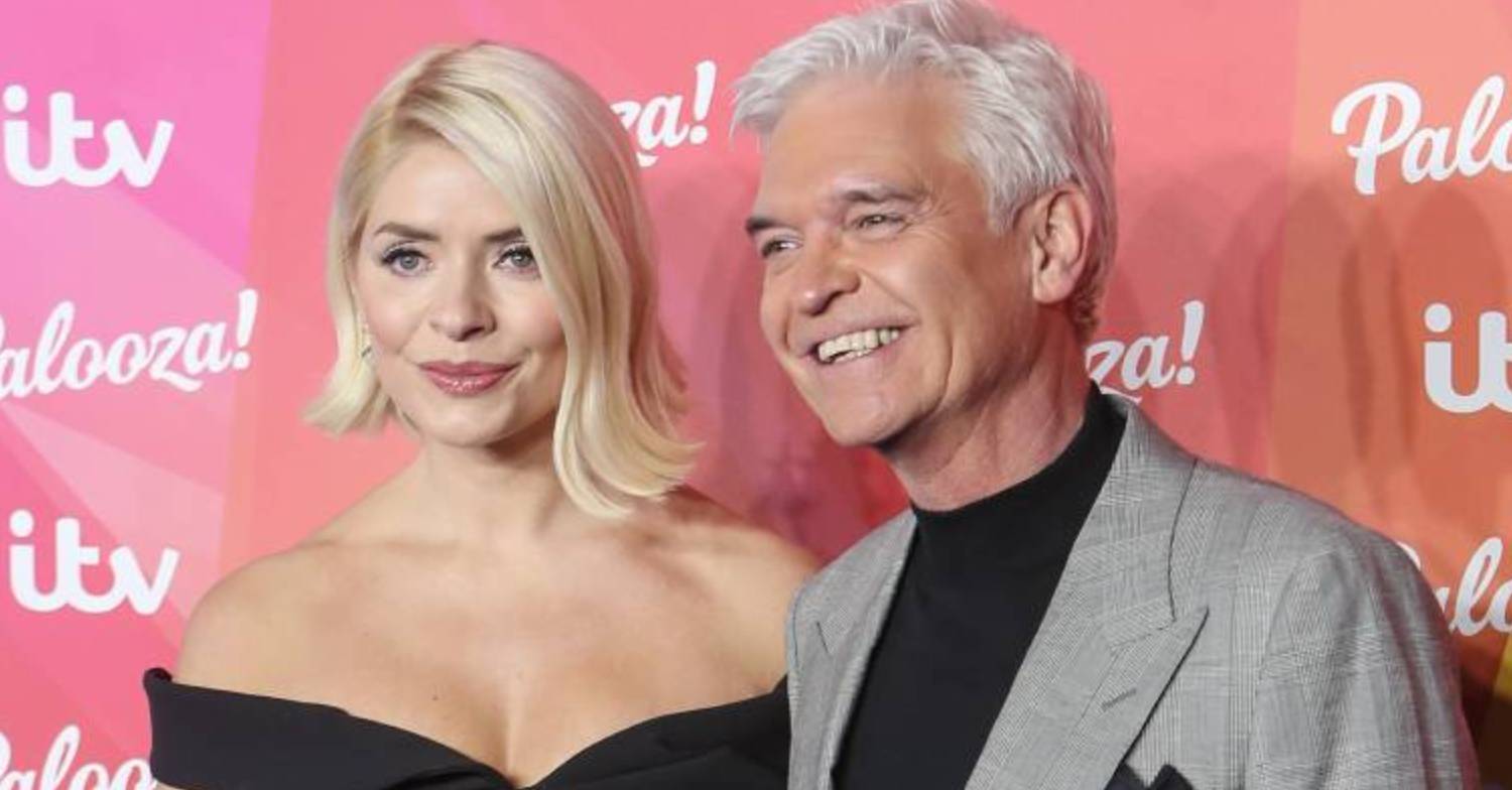 Dancing On Ice hosts Holly Willoughby and Phillip Schofield pose for cameras