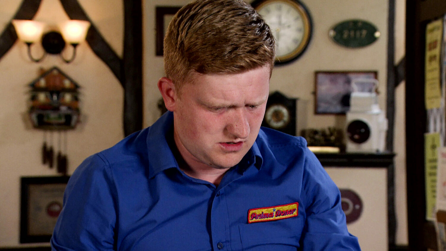 Coronation Street Chesney looking down, shocked