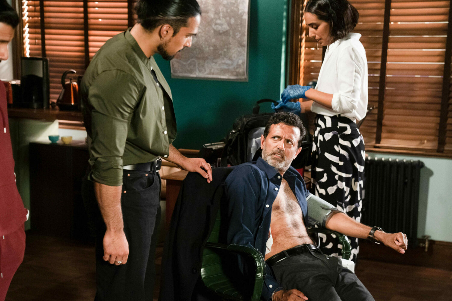 EastEnders Ravi looking at an ill Nish