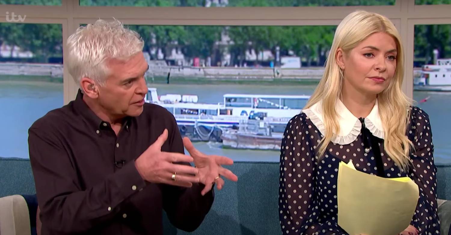 Holly Willoughby gazes ahead as Phillip Schofield speaks