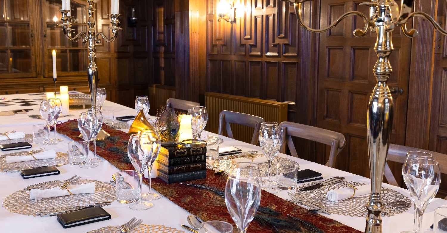 Dining table featuring drinks and plates