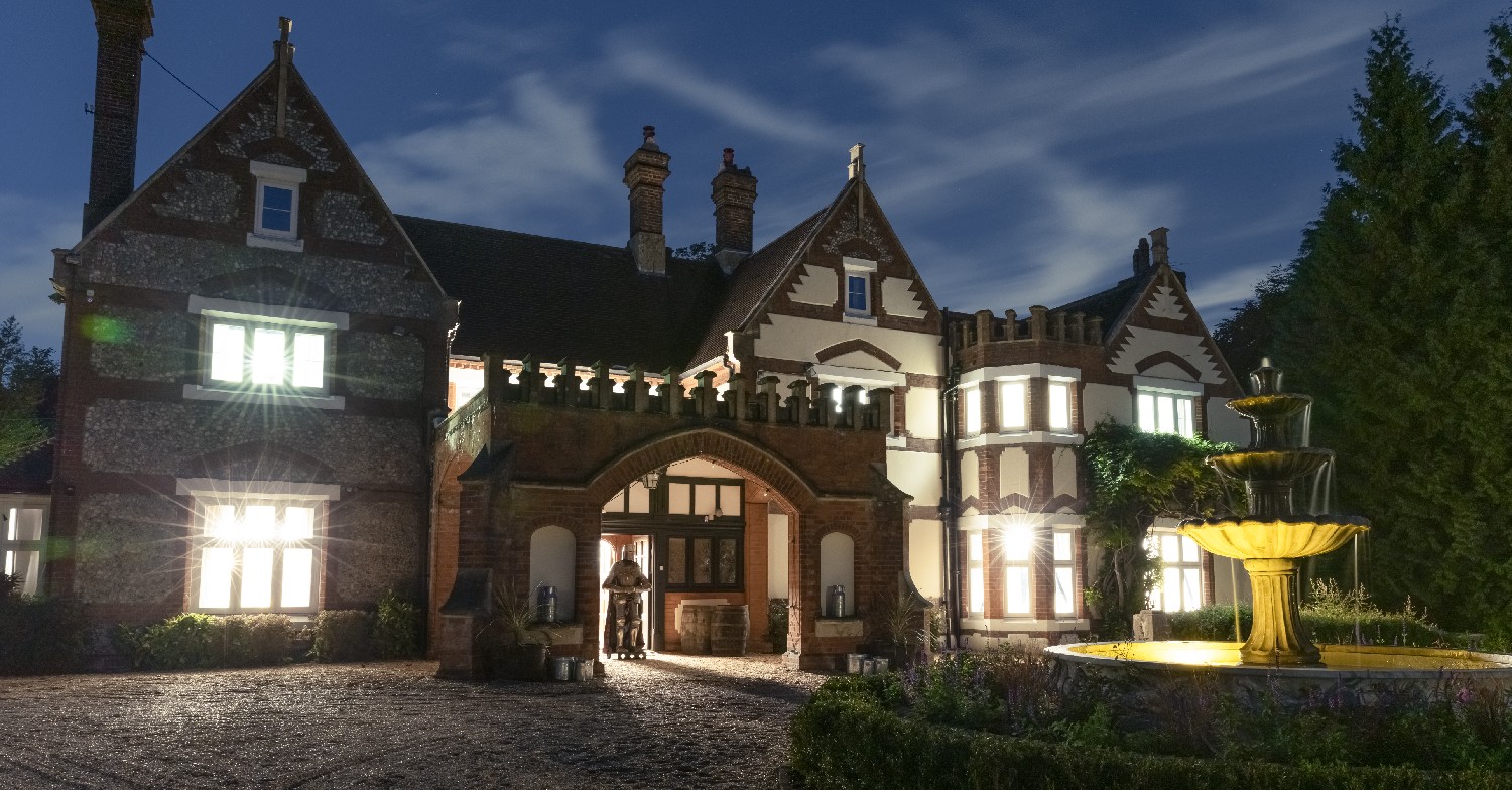 A mansion lit up for Halloween