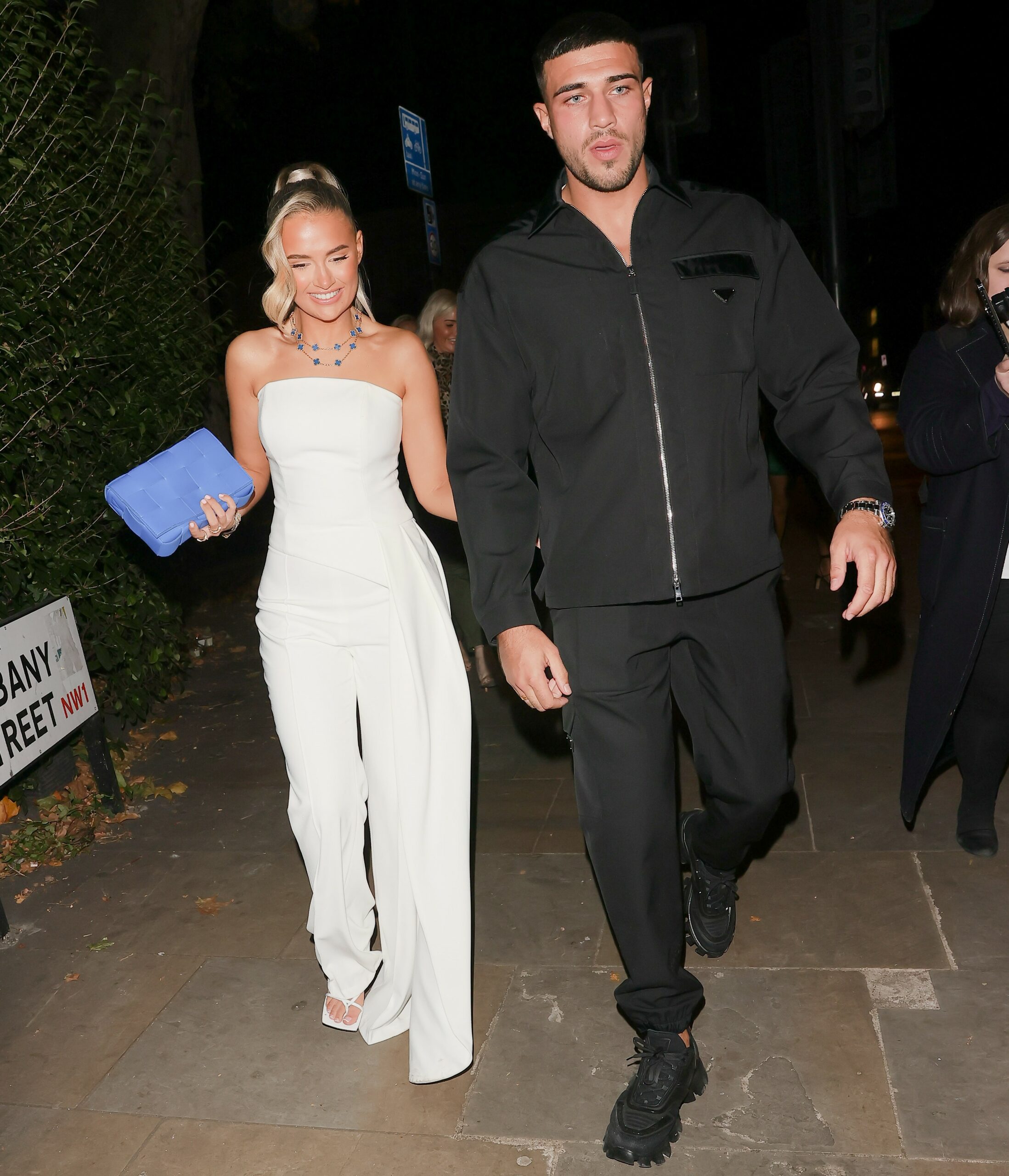 Molly-Mae Hague smiling as she holds hands with Tommy Fury