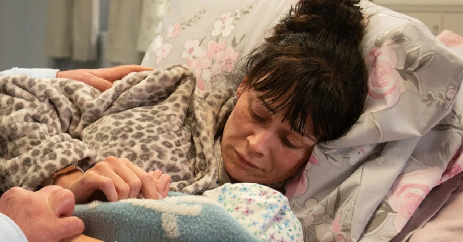 Emmerdale's Chas lying in bed with her baby looking sad