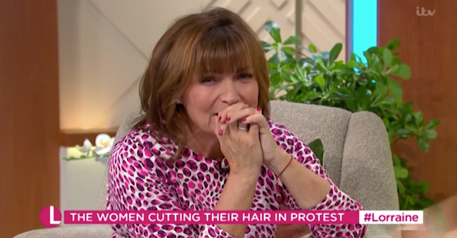 Lorraine Kelly covering her mouth today