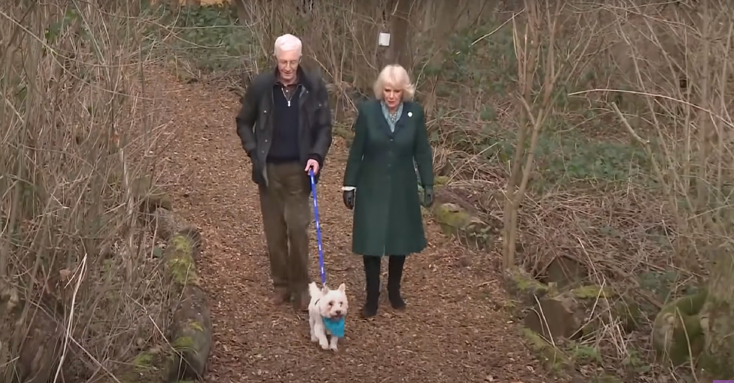 Paul O'Grady and Camilla walking a dog in the woods