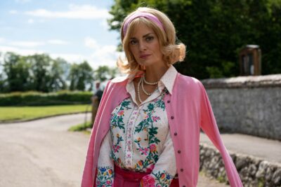 Morgana Robinson wearing pink in The Larkins