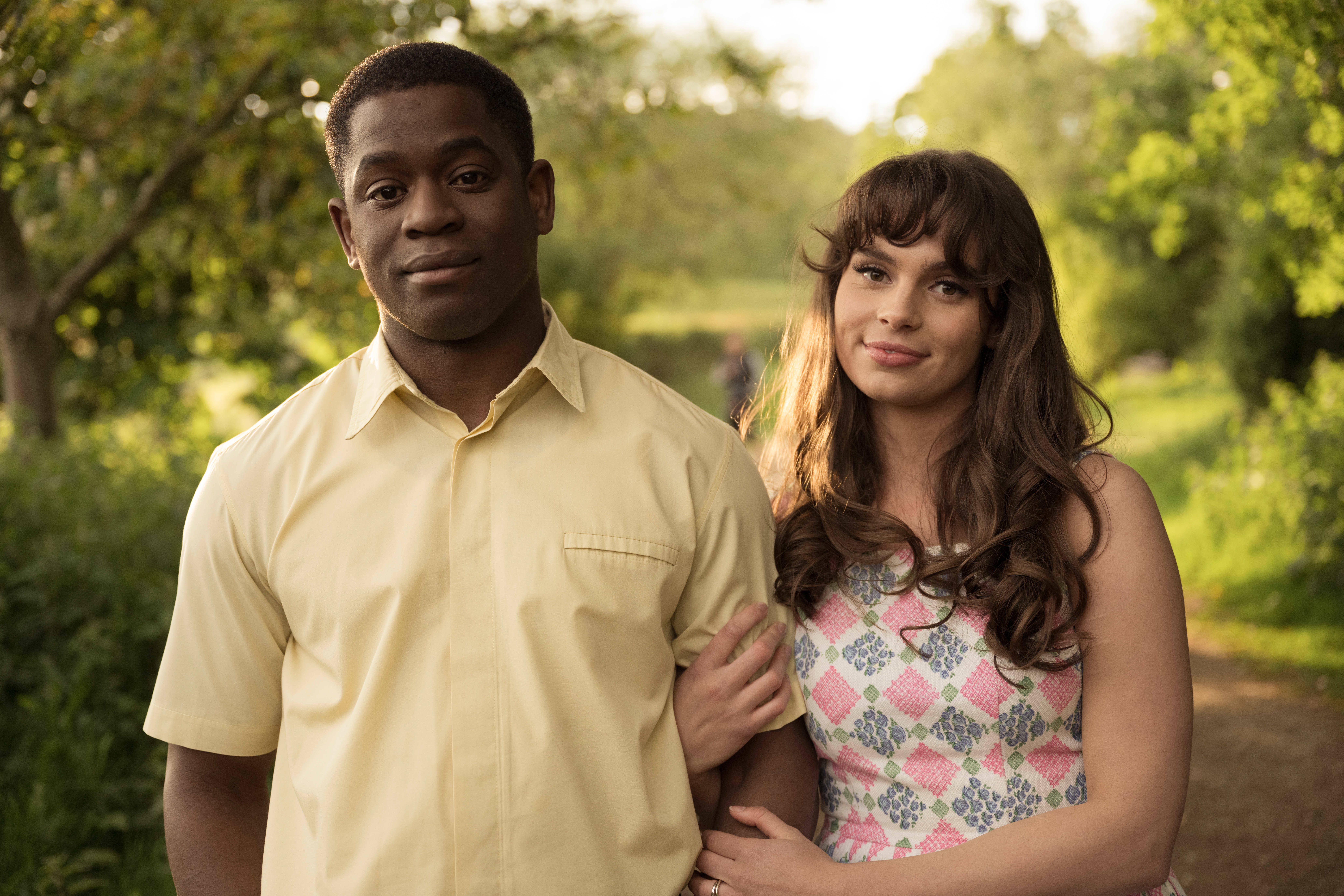 Joelle Rae and Tok Stephen linking arms in The Larkins