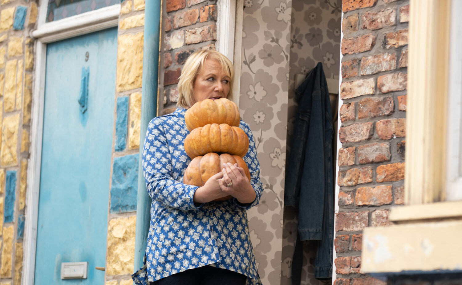 Coronation Street Eileen struggling with three pumpkins