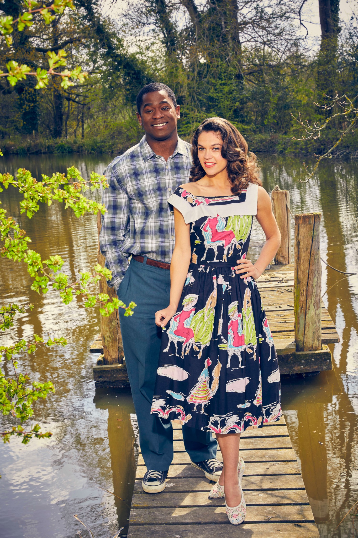 Sabrina Bartlett standing next to Tok Stephen in The Larkins