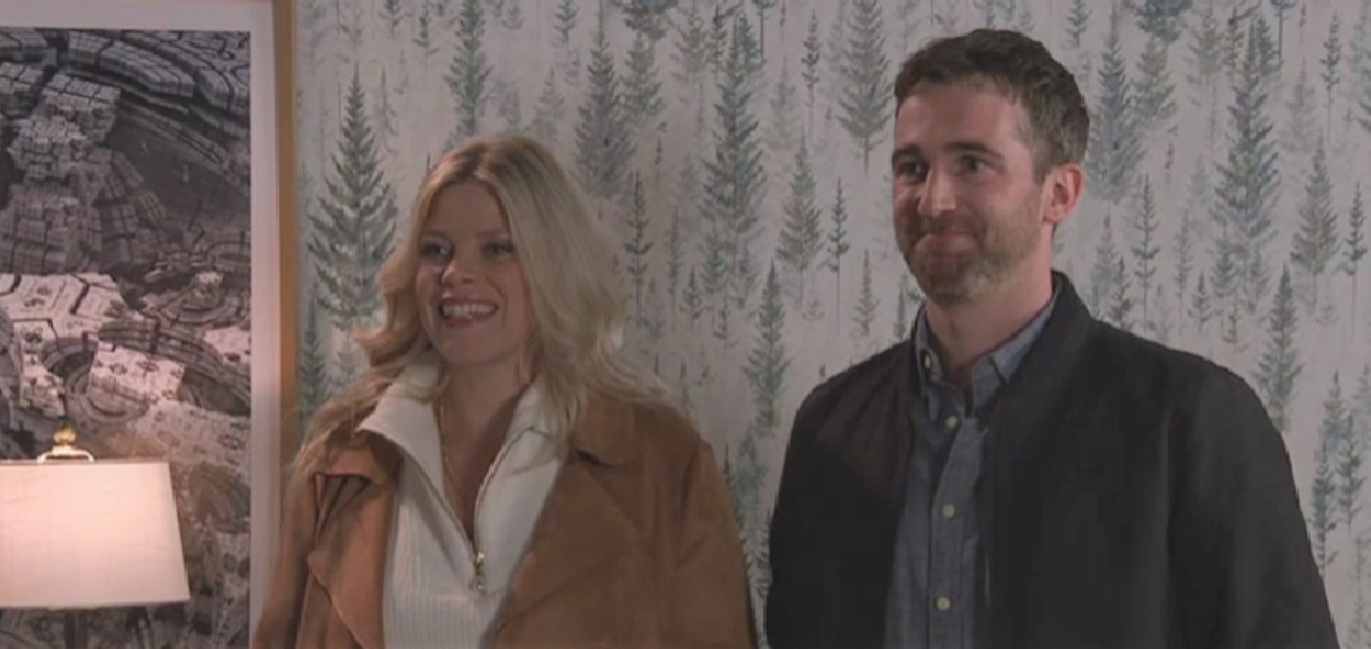 Esther and Mike smiling in Coronation Street