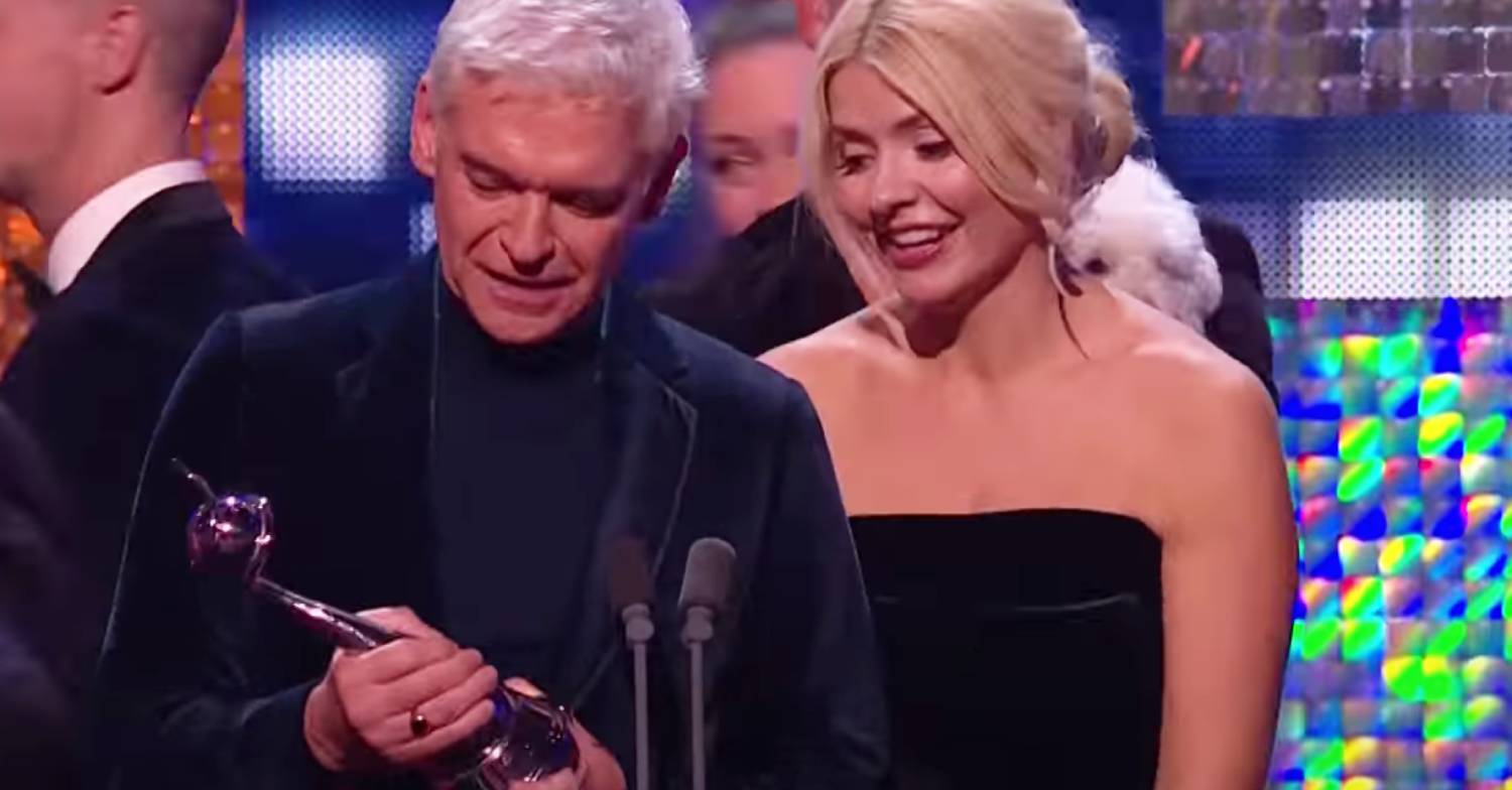 Phillip Schofield and Holly Willoughby look at the award