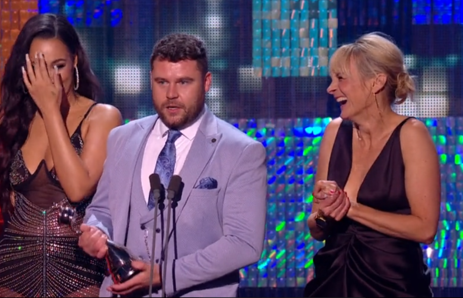 Danny Miller holding an NTA 