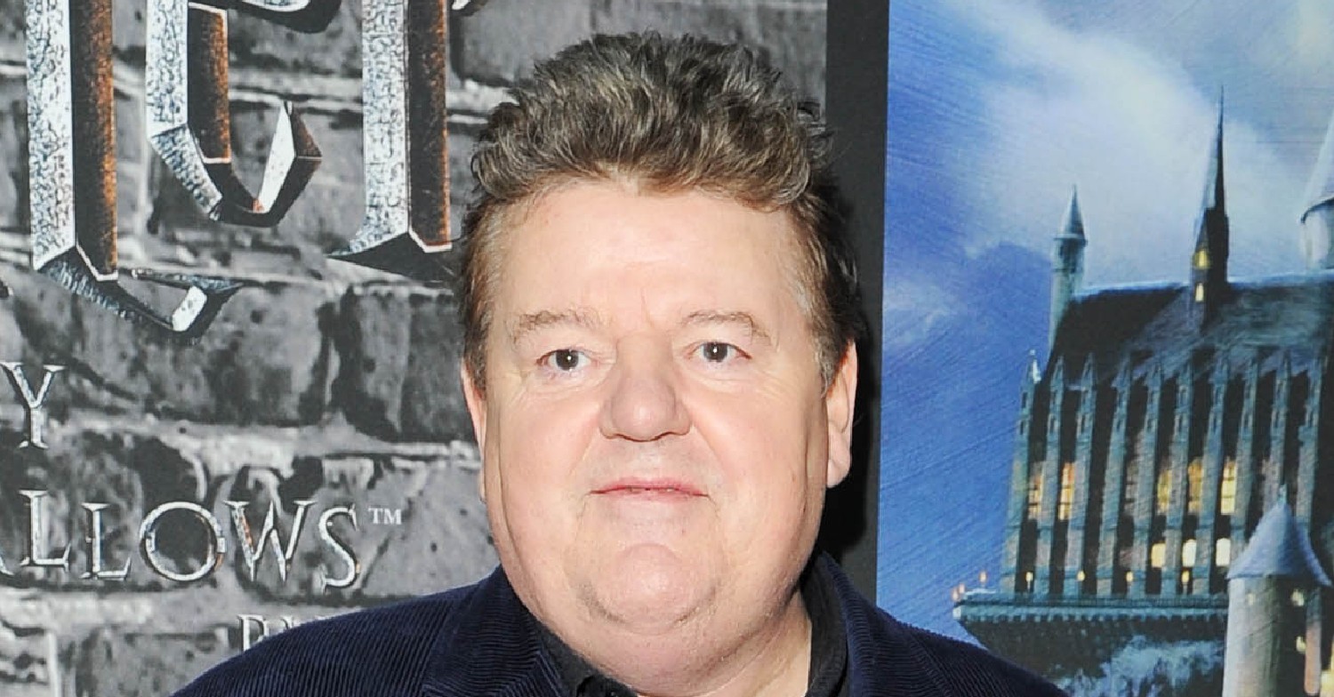 Robbie Coltrane poses at Harry Potter world