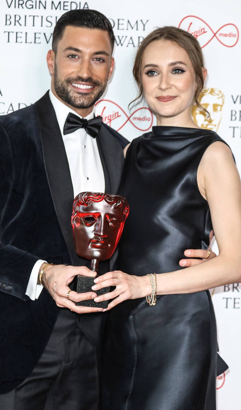 Giovanni Pernice and Rose Ayling-Ellis hold a BAFTA