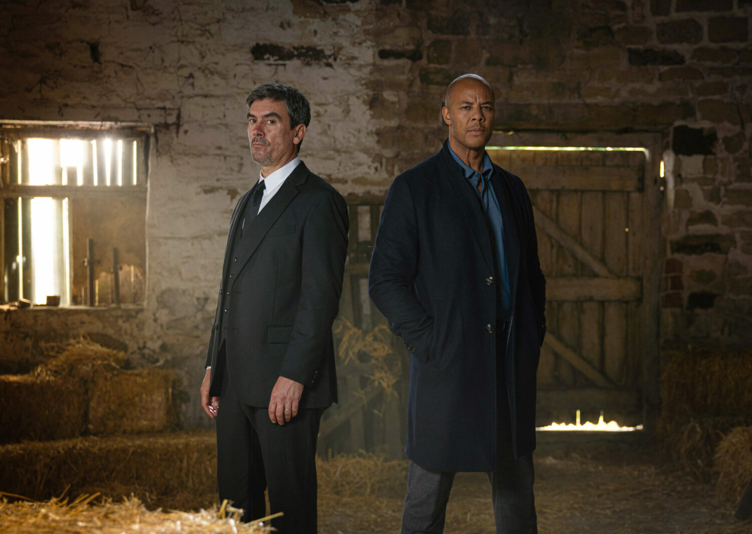 Emmerdale Cain and Al looking angry in a barn
