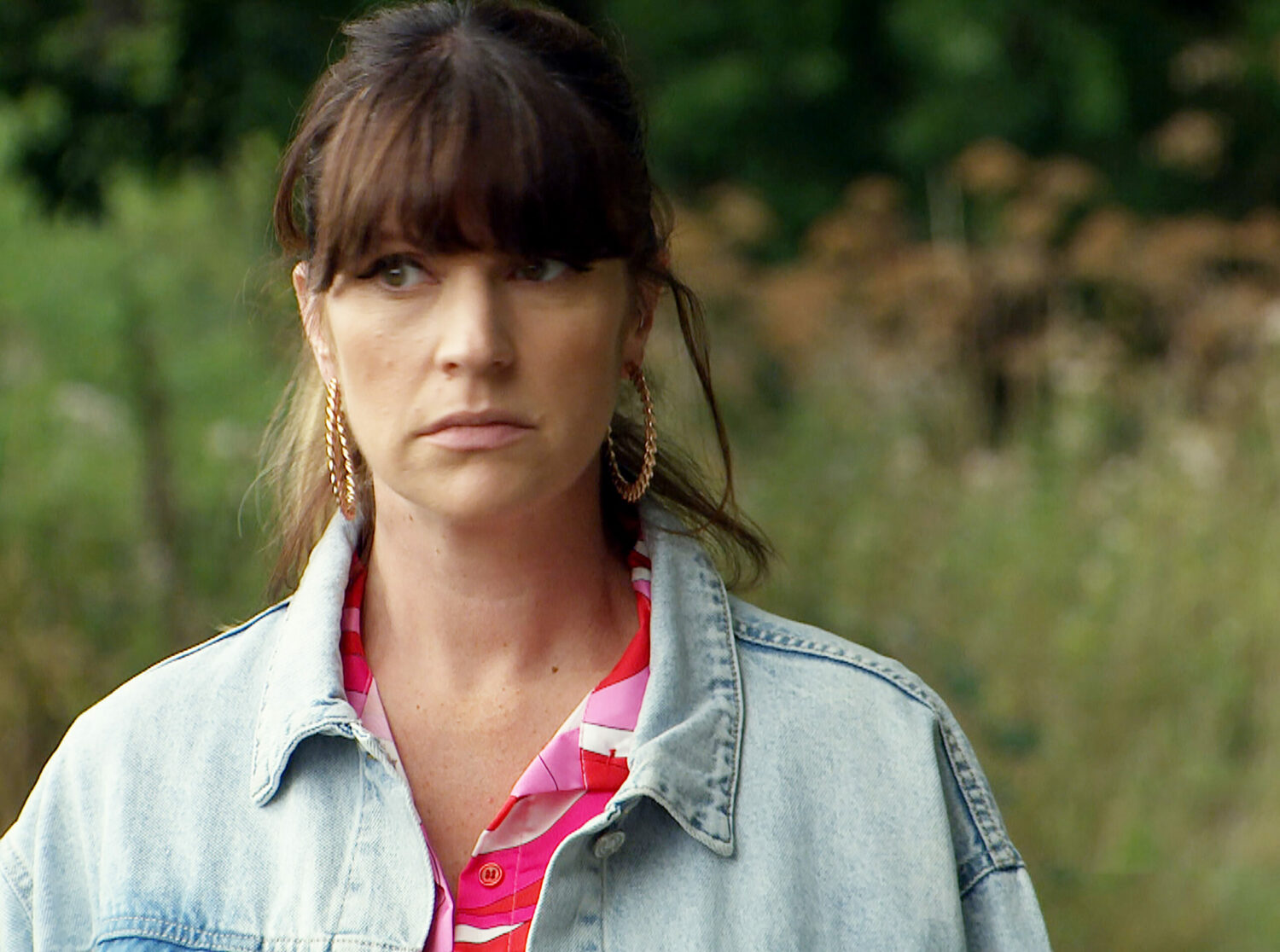 Kerry in Emmerdale looks worried after hearing a gunshot