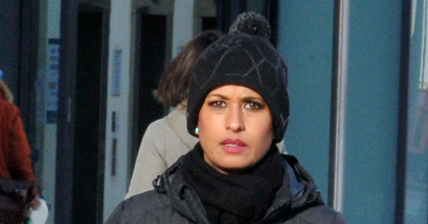 Naga Munchety in a hat in the street 